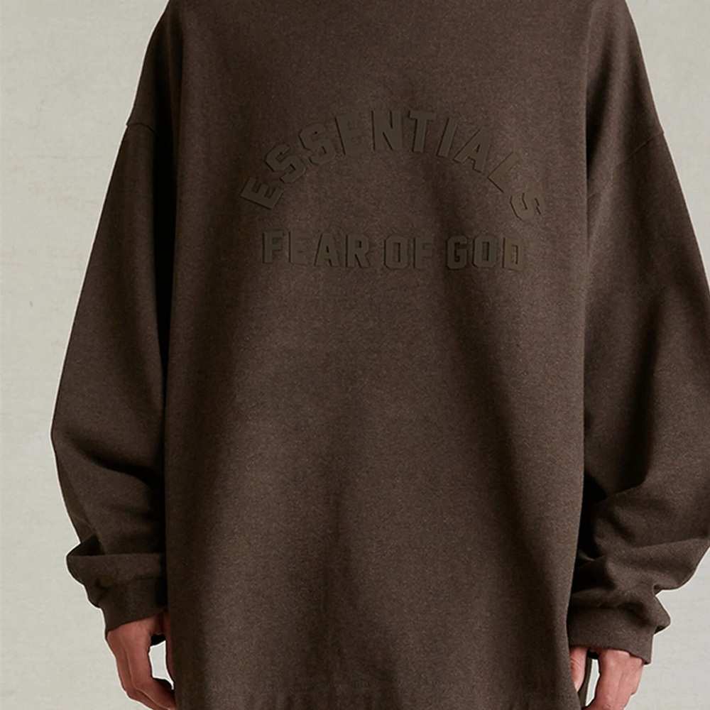 Oversized chocolate color Essentials sweatshirt will fit a men L or XL